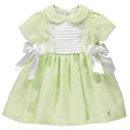 Green and white dress with bows and ribs