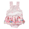 Pink strappy bodysuit with colorful pattern, ruffles and bow